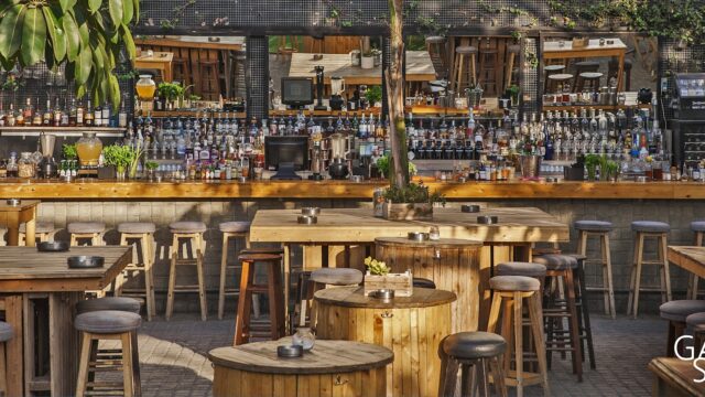 a bar with tables and chairs