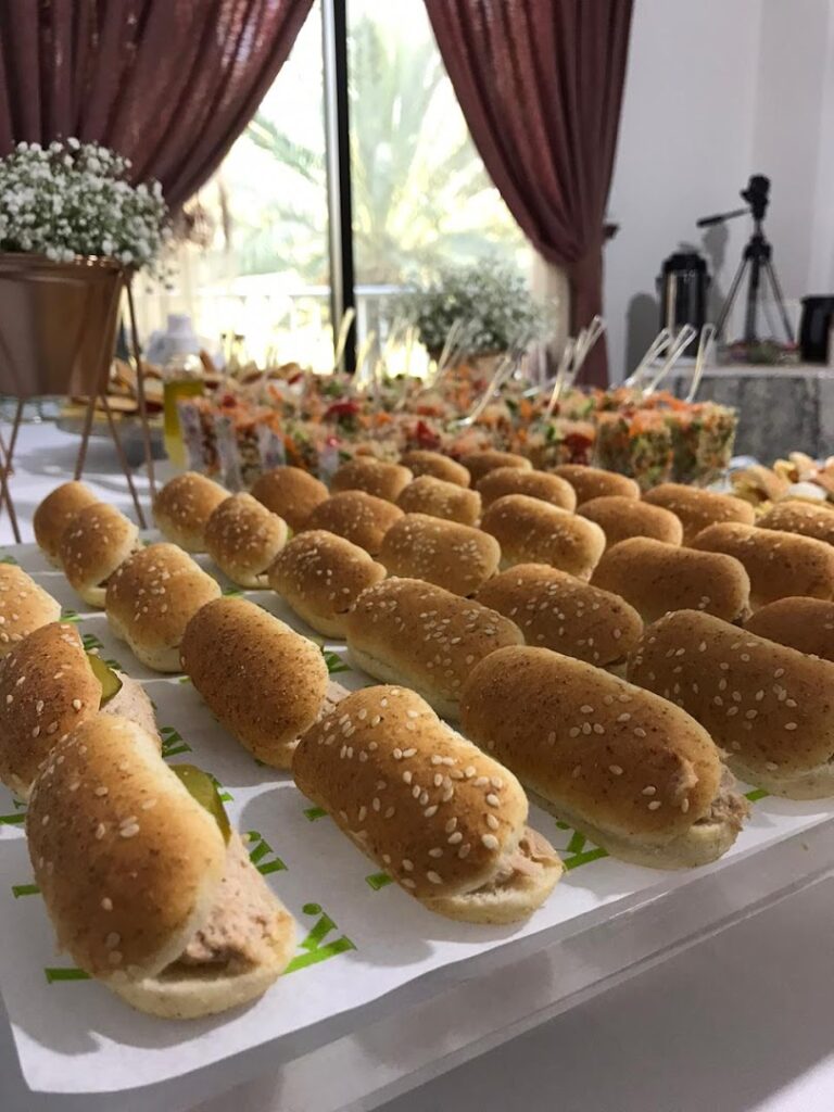 A table with food on it, showcasing Kaakat Gourmet.