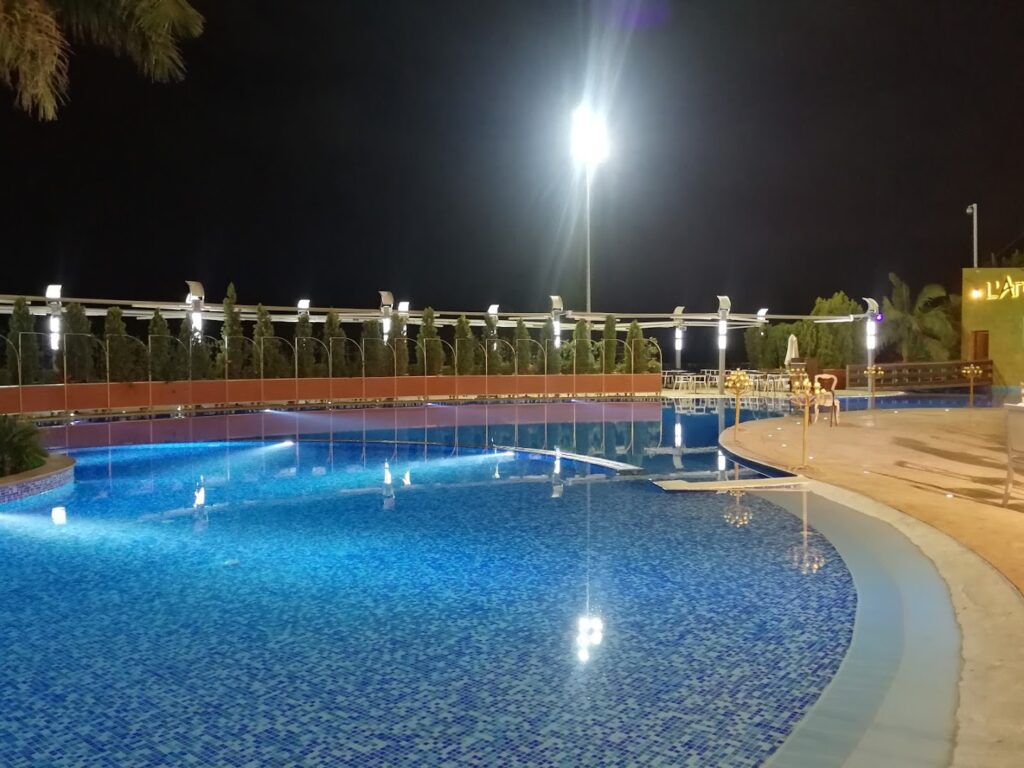 a pool with lights at night