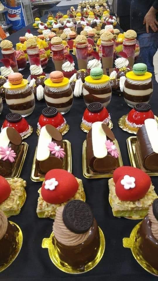 A table full of desserts catered by Larissa Catering.