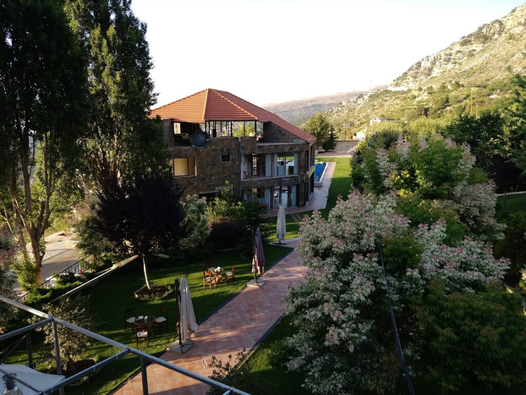 a house with a lawn and trees