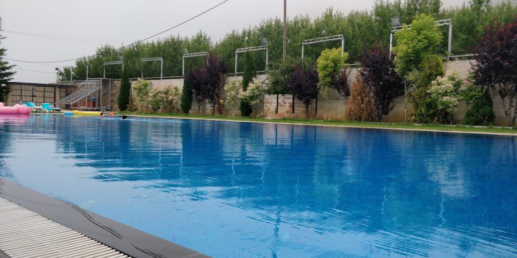 a pool with trees in the background