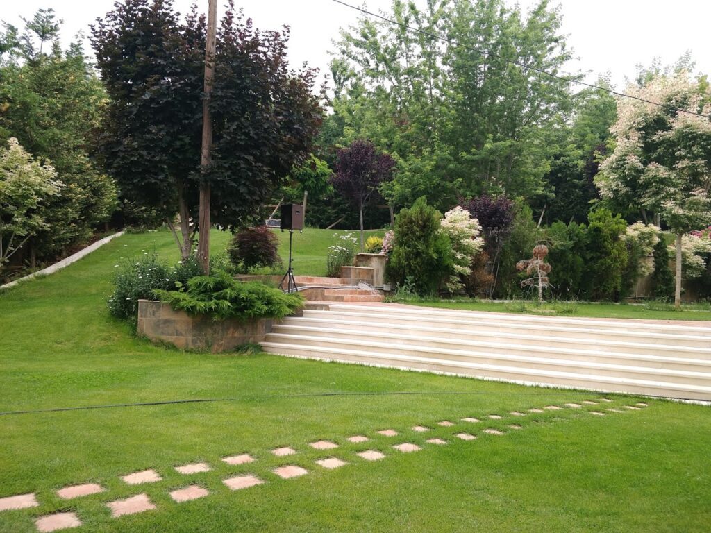 a garden with a set of stairs and trees