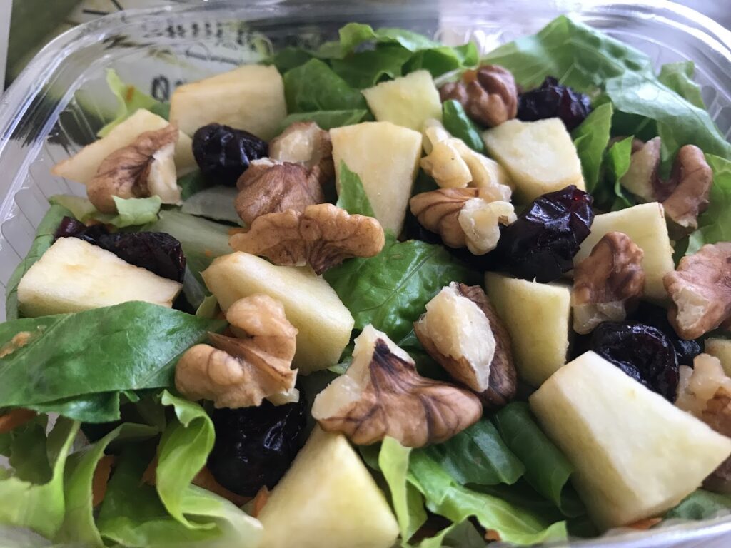 "My Oasis" is a refreshing salad with apples and nuts served in a captivating glass bowl.