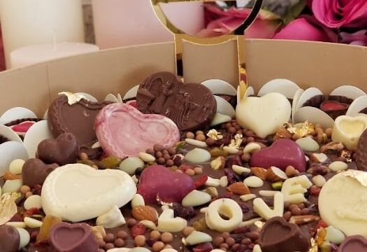 a box of chocolate hearts and nuts