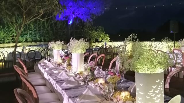 a long table set for a dinner party