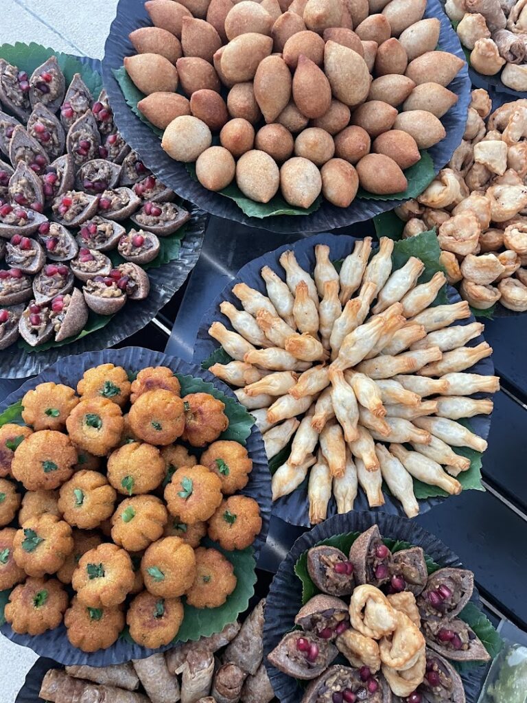 A group of plates of food provided by Nazira Catering.