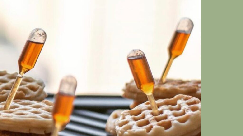 "A waffle with a dropper sticking out of it is an unconventional creation offered by Okra Catering."