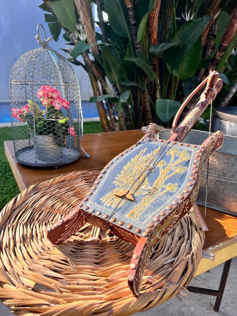 Okra Catering placed a wooden sled on a table.