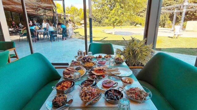 A table with food on it featuring the keyword "Sama Chtaura".