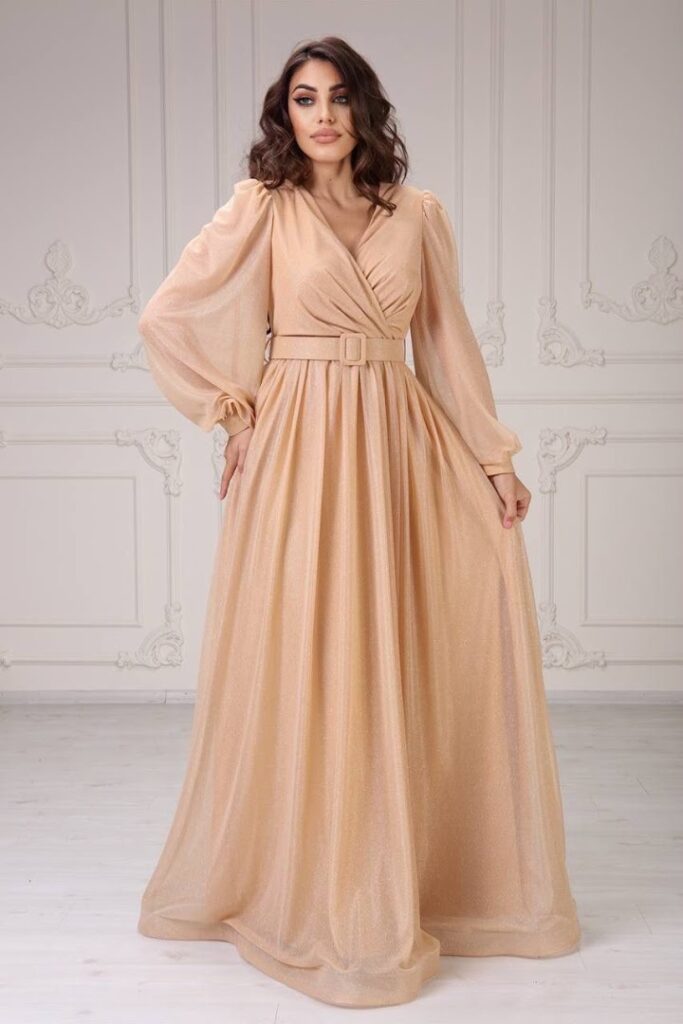 a woman in a peach dress