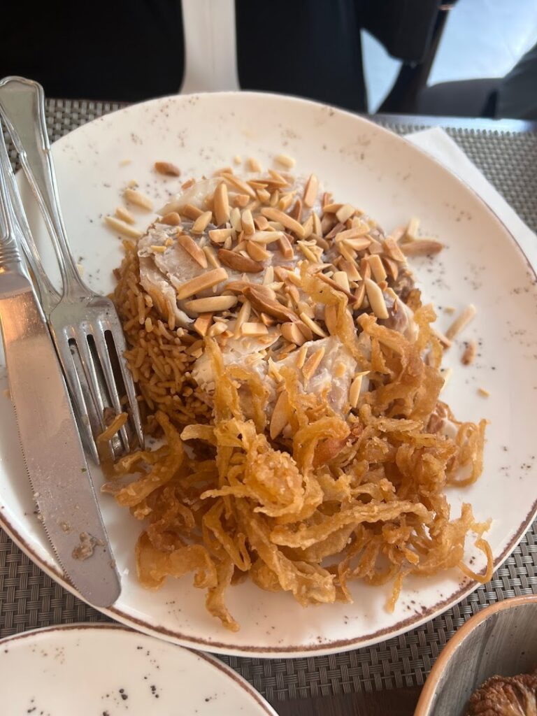 A plate of food with a fork and knife at Socrate Restaurant.