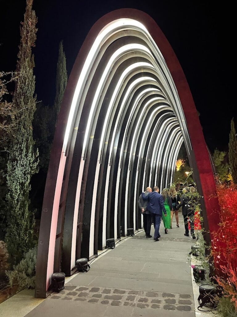 a group of people walking on a walkway