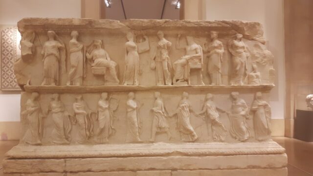 a stone carving of people