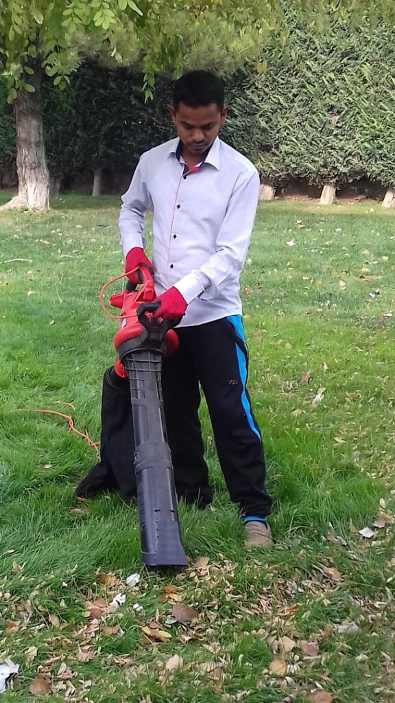 a man holding a blower