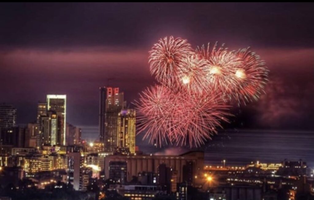 TABBARA FIREWORKS CO. lights up the sky over a city with mesmerizing fireworks.