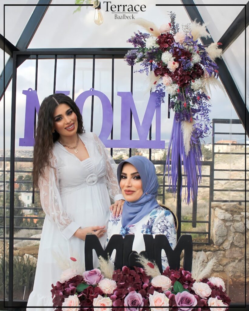Two women posing for a picture on the Terrace Baalbeck.