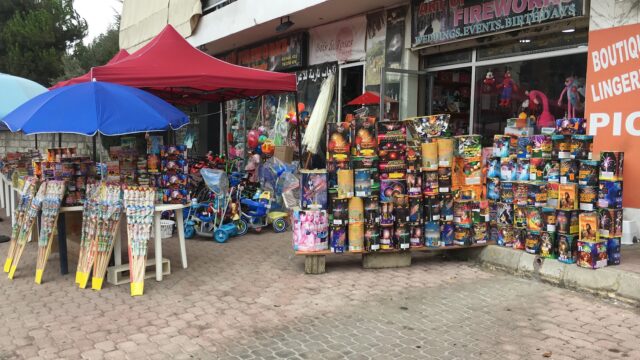 A storefront with a dazzling display of fireworks showcasing the Art of fireworks.