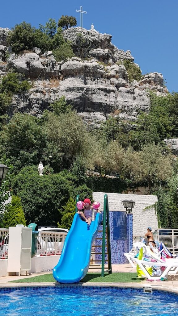 A child on a slide at Jardin Des Lys.