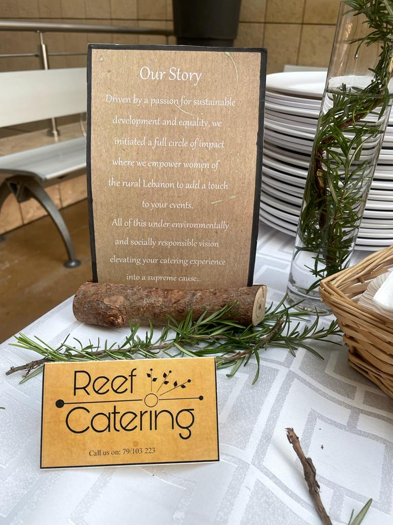 "Reef Catering offers a menu on a table."
