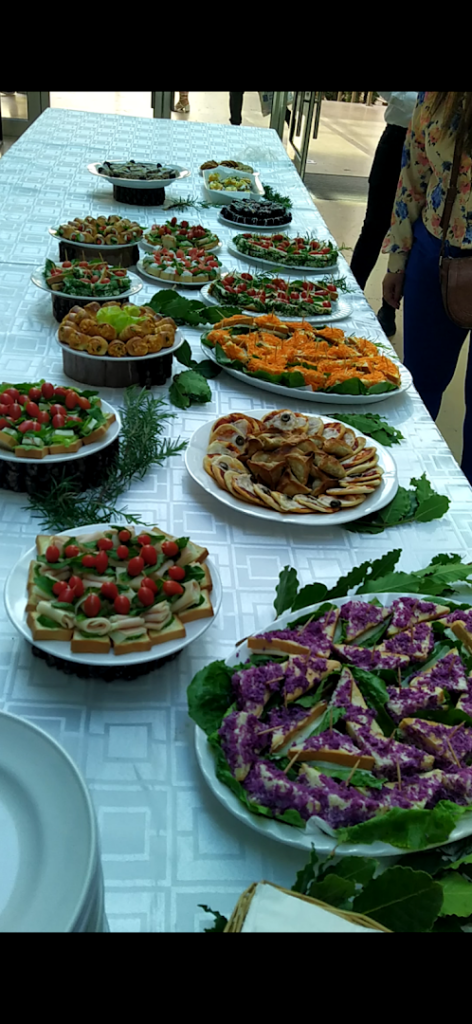 Reef Catering provides a table full of food.